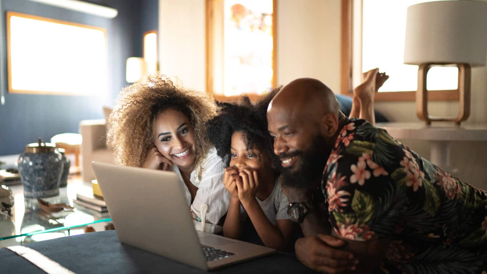 family watching movie on a laptop