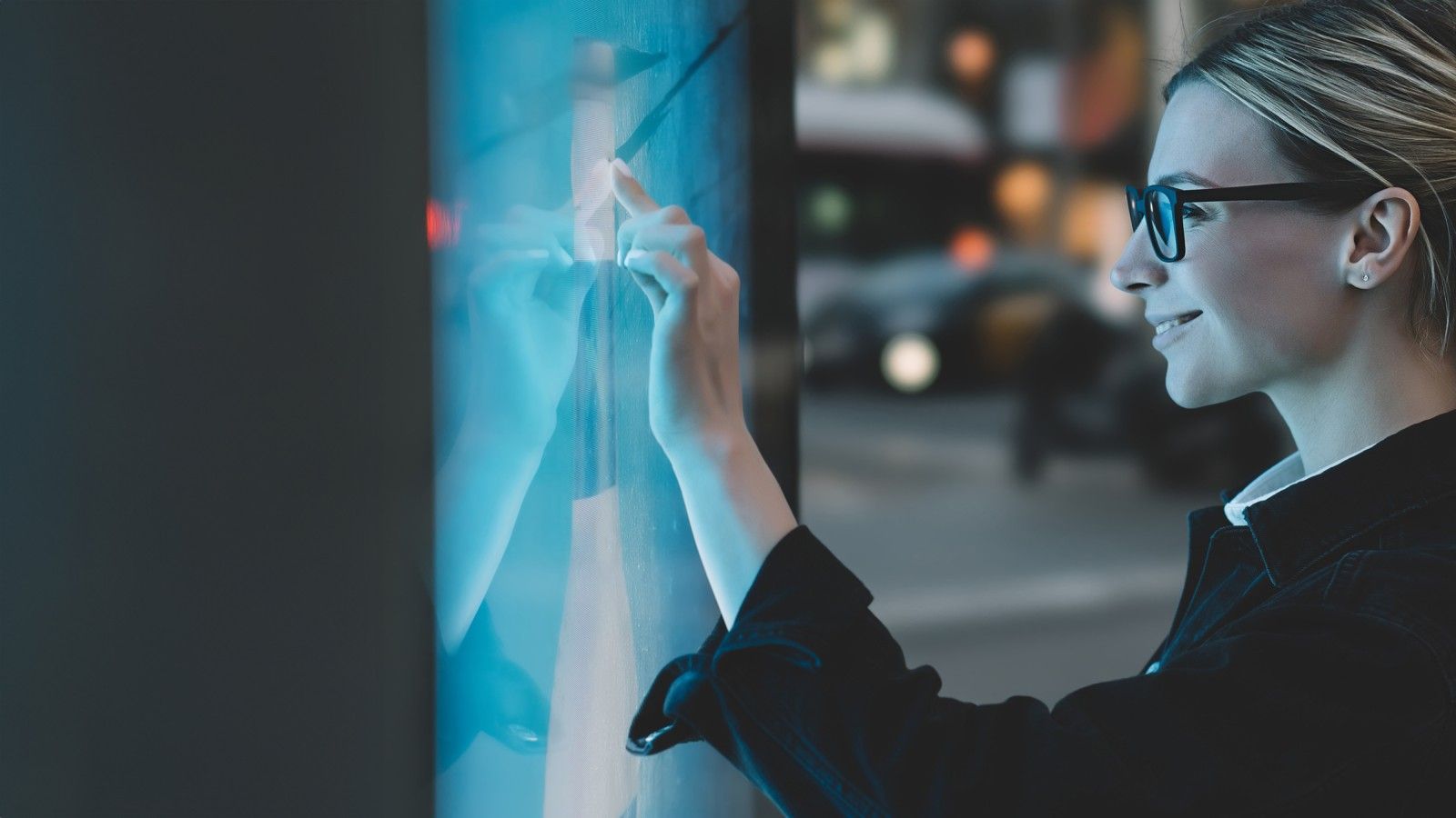 Woman touching a screen